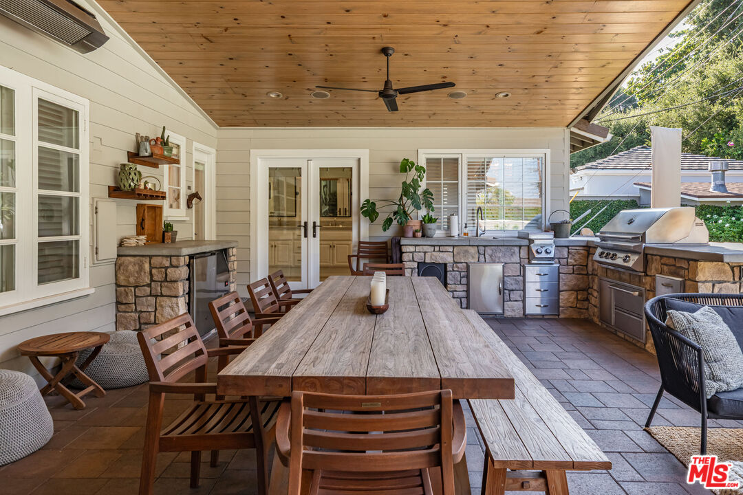 875 Hugo Reid Drive Arcadia, CA 91007 - Photo 35 of 53 a view of a patio with table and chairs