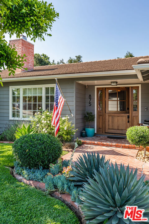 875 Hugo Reid Drive Arcadia, CA 91007 - Photo 4 of 53 a front view of a house with garden