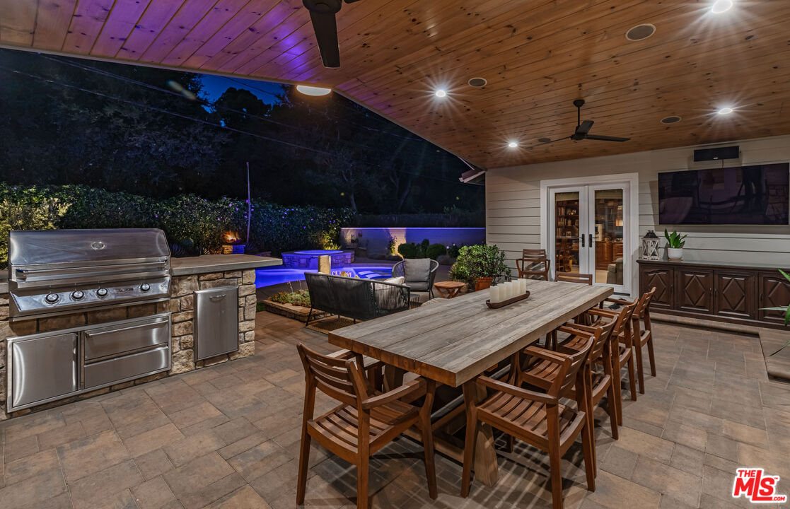875 Hugo Reid Drive Arcadia, CA 91007 - Photo 45 of 53 a view of a dining table and chairs in the patio