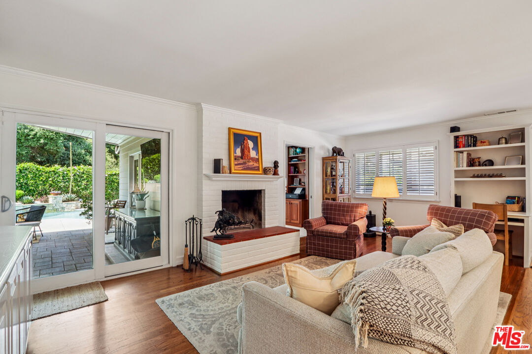 875 Hugo Reid Drive Arcadia, CA 91007 - Photo 10 of 53 a living room with furniture and a fireplace