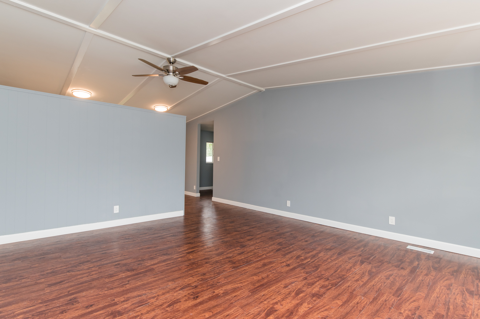 734 Surrey Drive Streamwood, IL 60107 - Photo 11 of 36 a view of an empty room with wooden floor