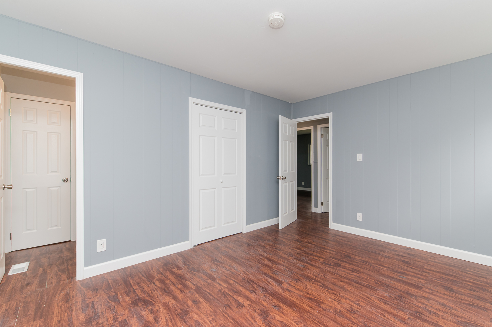 734 Surrey Drive Streamwood, IL 60107 - Photo 19 of 36 a view of an empty room with wooden floor