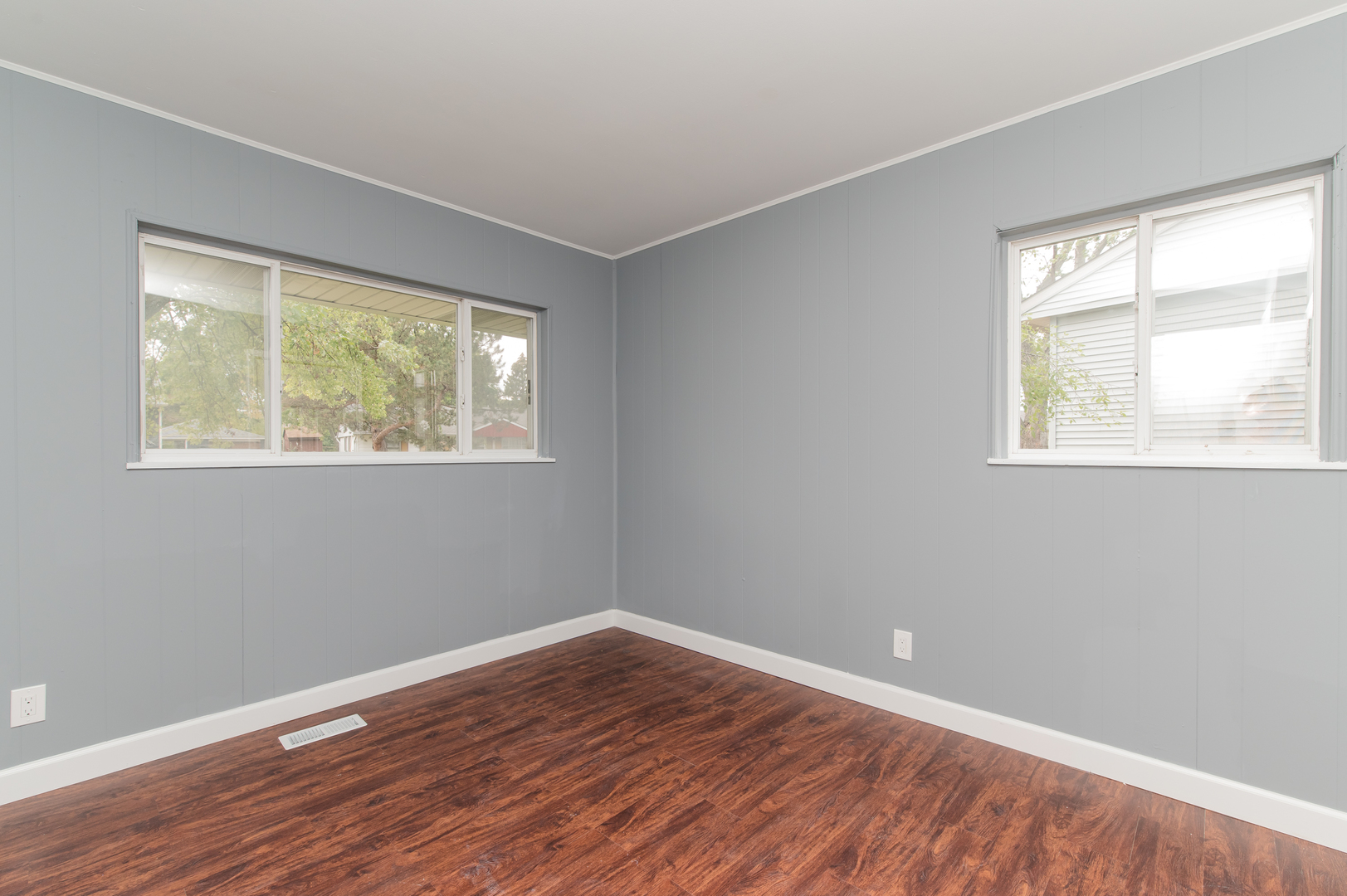 734 Surrey Drive Streamwood, IL 60107 - Photo 20 of 36 a view of an empty room with wooden floor and a window