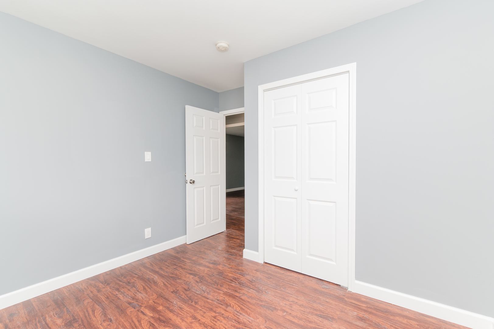734 Surrey Drive Streamwood, IL 60107 - Photo 23 of 36 a view of an empty room with wooden floor
