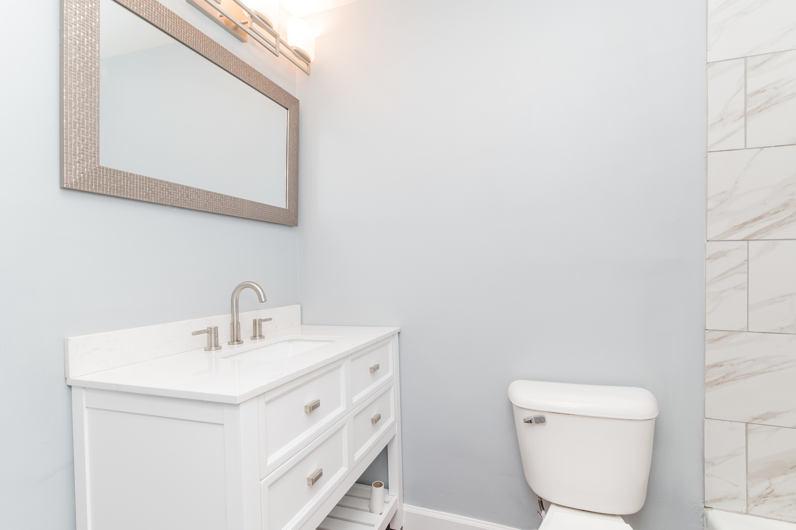 734 Surrey Drive Streamwood, IL 60107 - Photo 25 of 36 a bathroom with a toilet sink and mirror