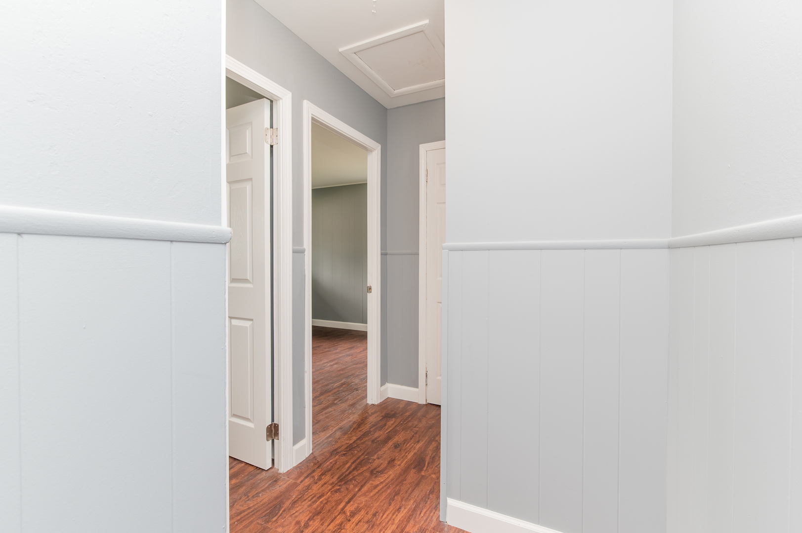 734 Surrey Drive Streamwood, IL 60107 - Photo 26 of 36 a view of a hallway with wooden floor