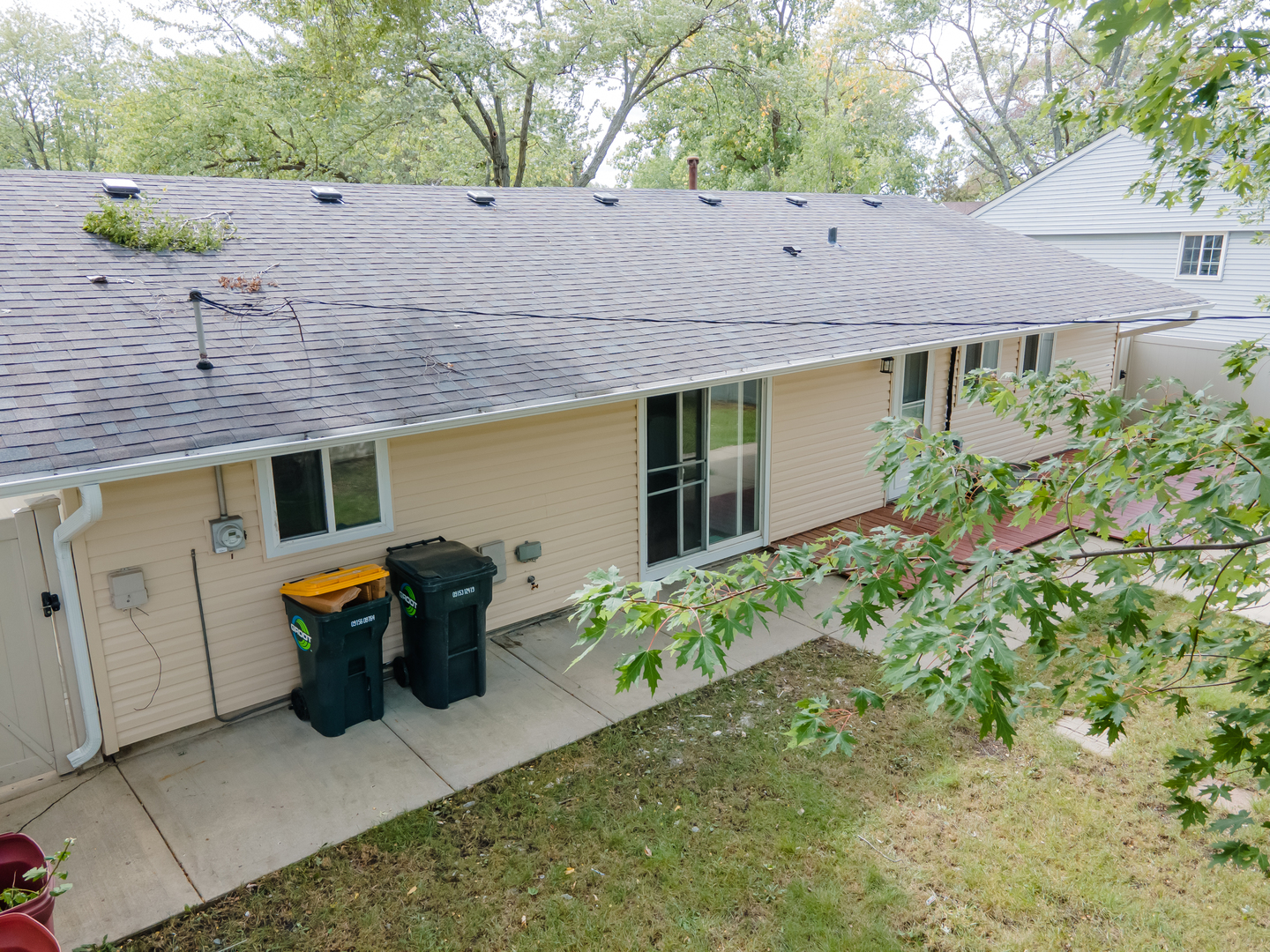 734 Surrey Drive Streamwood, IL 60107 - Photo 29 of 36 a view of a patio with table and chairs potted plants