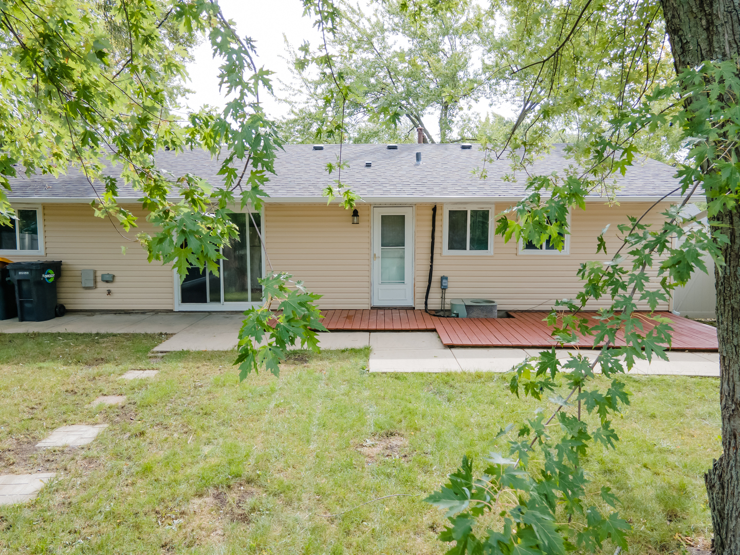 734 Surrey Drive Streamwood, IL 60107 - Photo 31 of 36 a front view of a house with garden