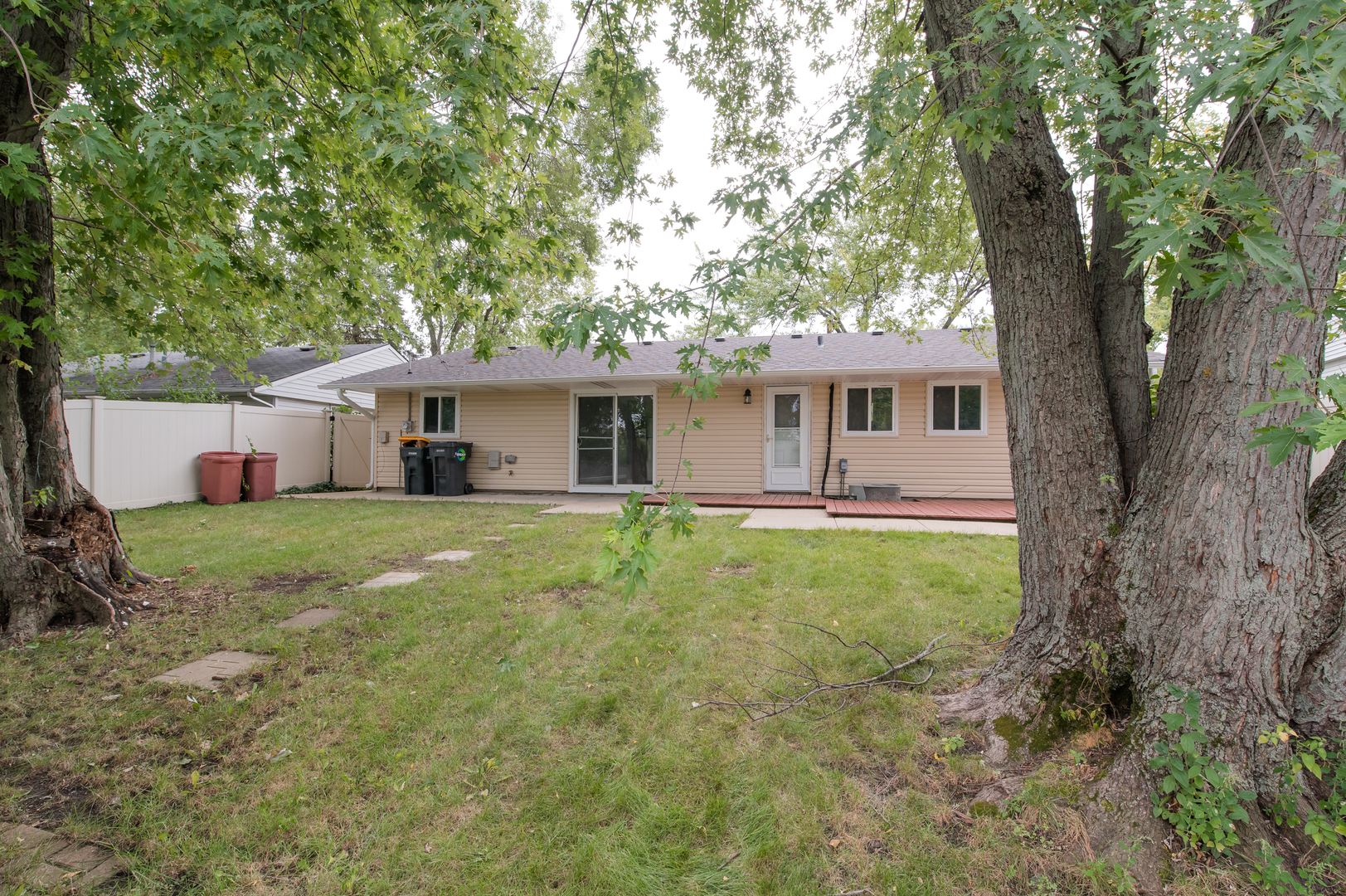 734 Surrey Drive Streamwood, IL 60107 - Photo 36 of 36 a front view of house with yard and green space