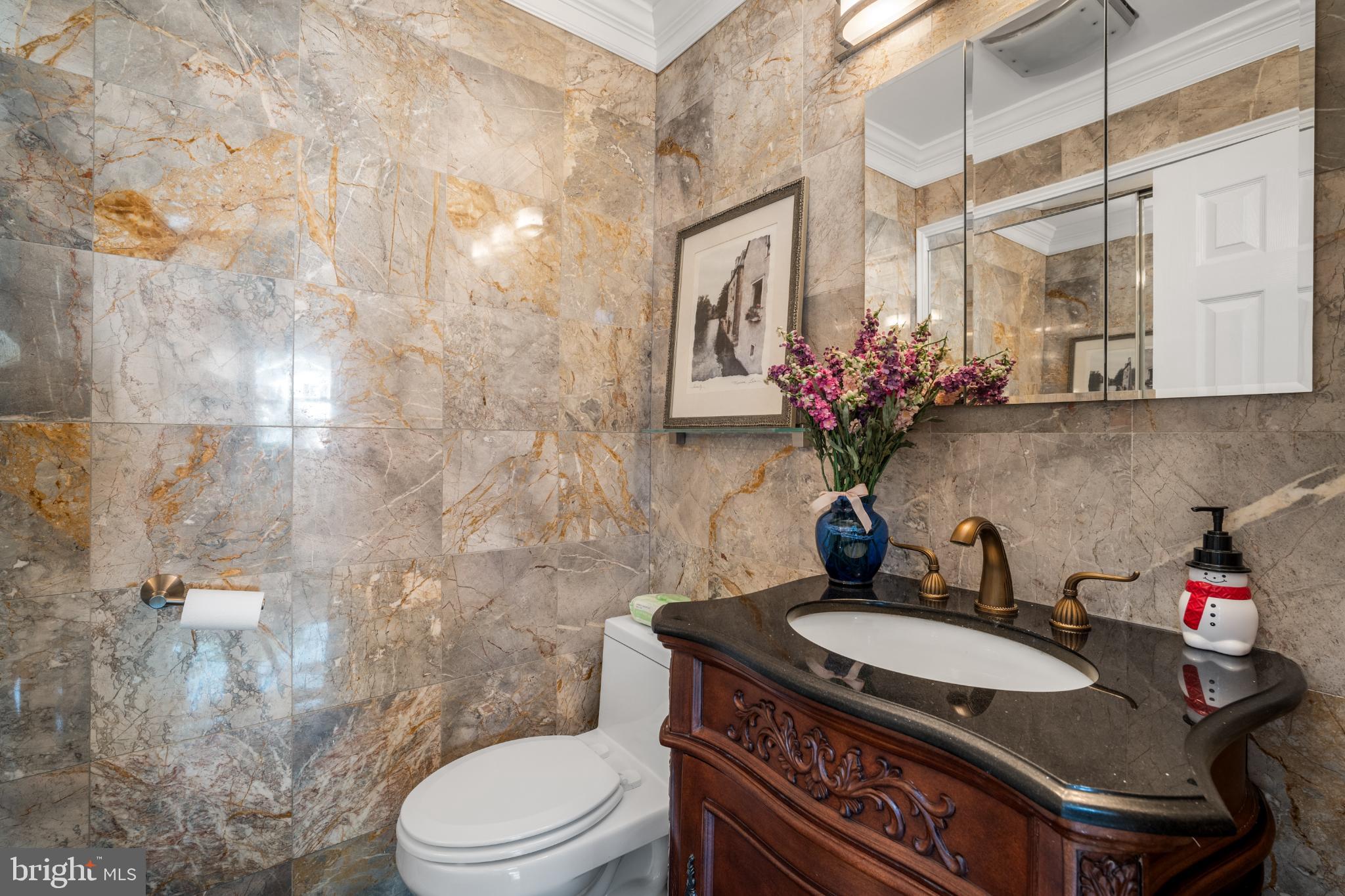 4104 Tulare Drive Silver Spring, MD 20906 - Photo 11 of 49 Elegant marble-clad powder room.