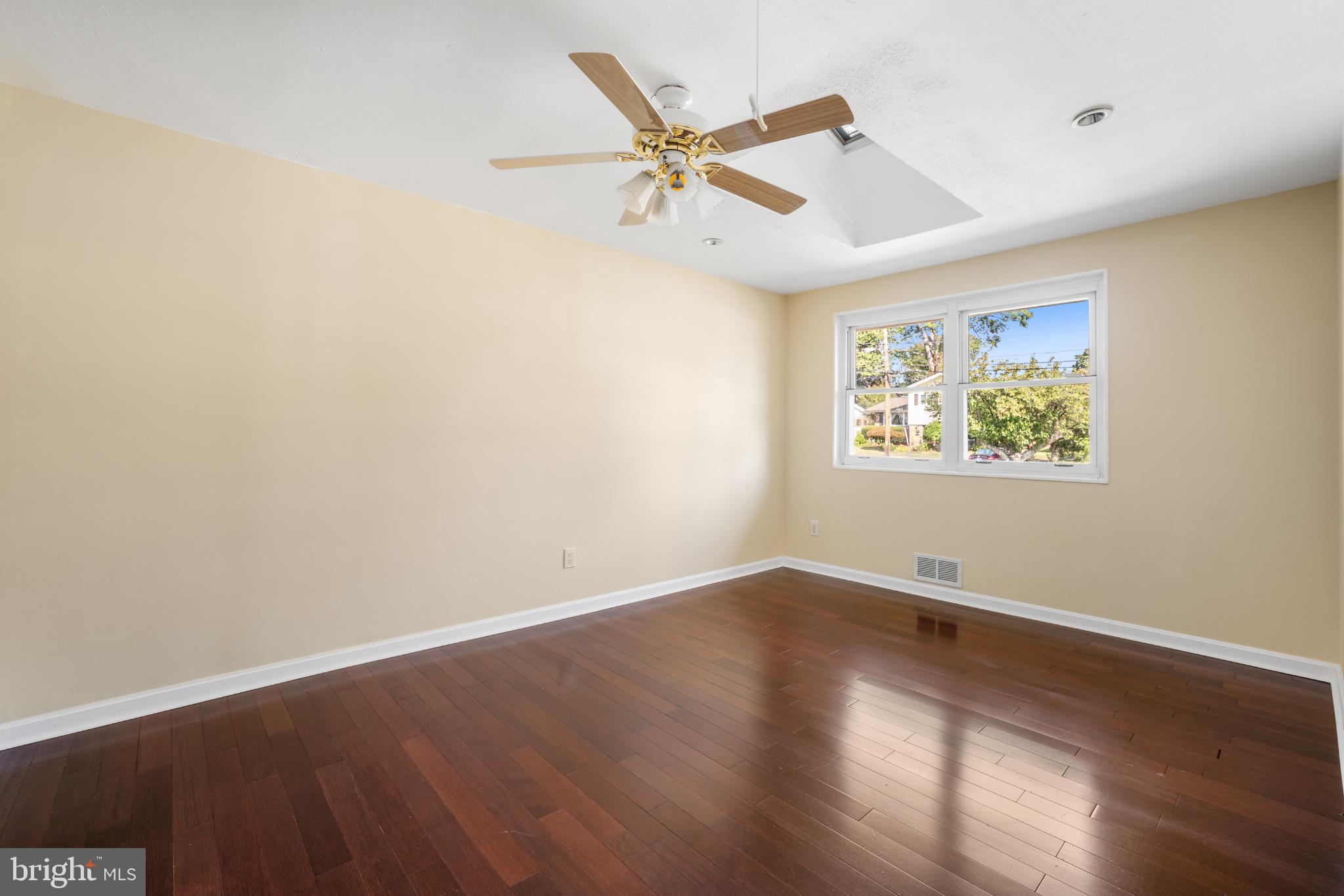 4104 Tulare Drive Silver Spring, MD 20906 - Photo 18 of 44 an empty room with wooden floor and ceiling fan