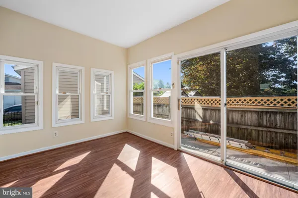 a view of wooden floor and closet in a room