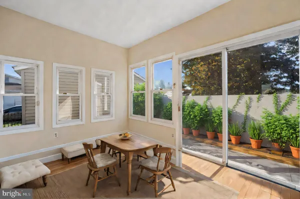 a view of a livingroom with workspace and a window