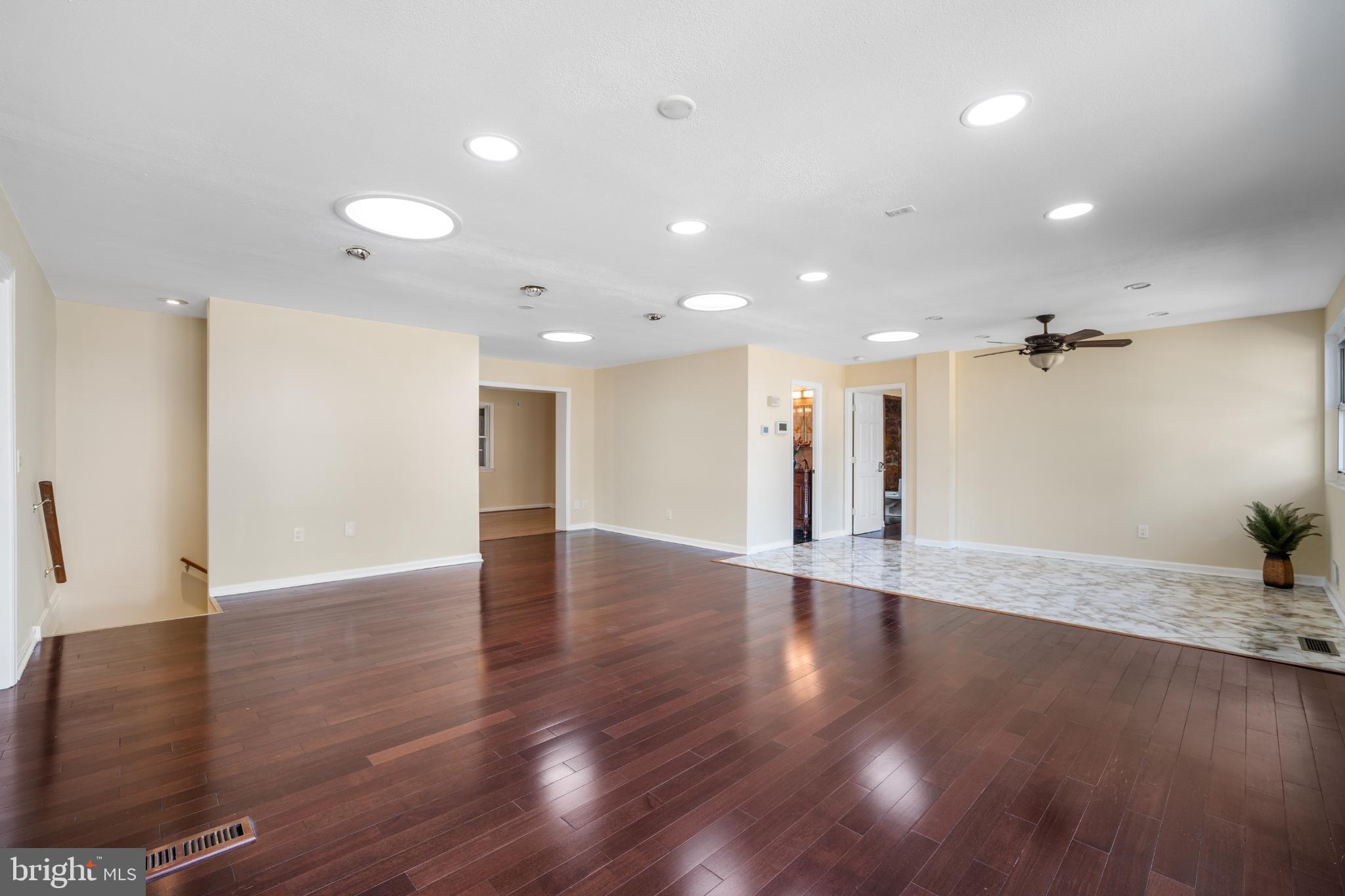 4104 Tulare Drive Silver Spring, MD 20906 - Photo 8 of 44 a view of an empty room with wooden floor and a cabinet