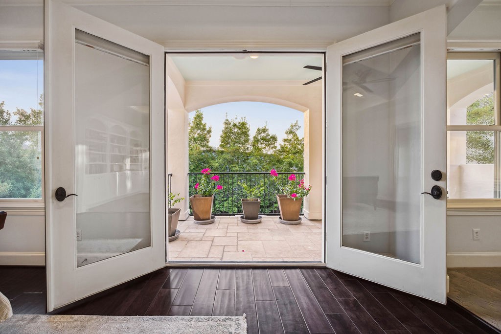2508 Brun Street Houston, TX 77019 - Photo 32 of 50 Just off the primary bedroom these elegant French doors lead to a charming balcony.