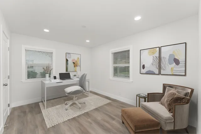 a work room with furniture and windows