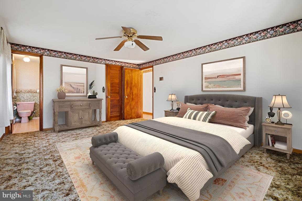 2701 Carrollton Road Finksburg, MD 21048 - Photo 23 of 66 a spacious bedroom with a bed and glass walk in closet