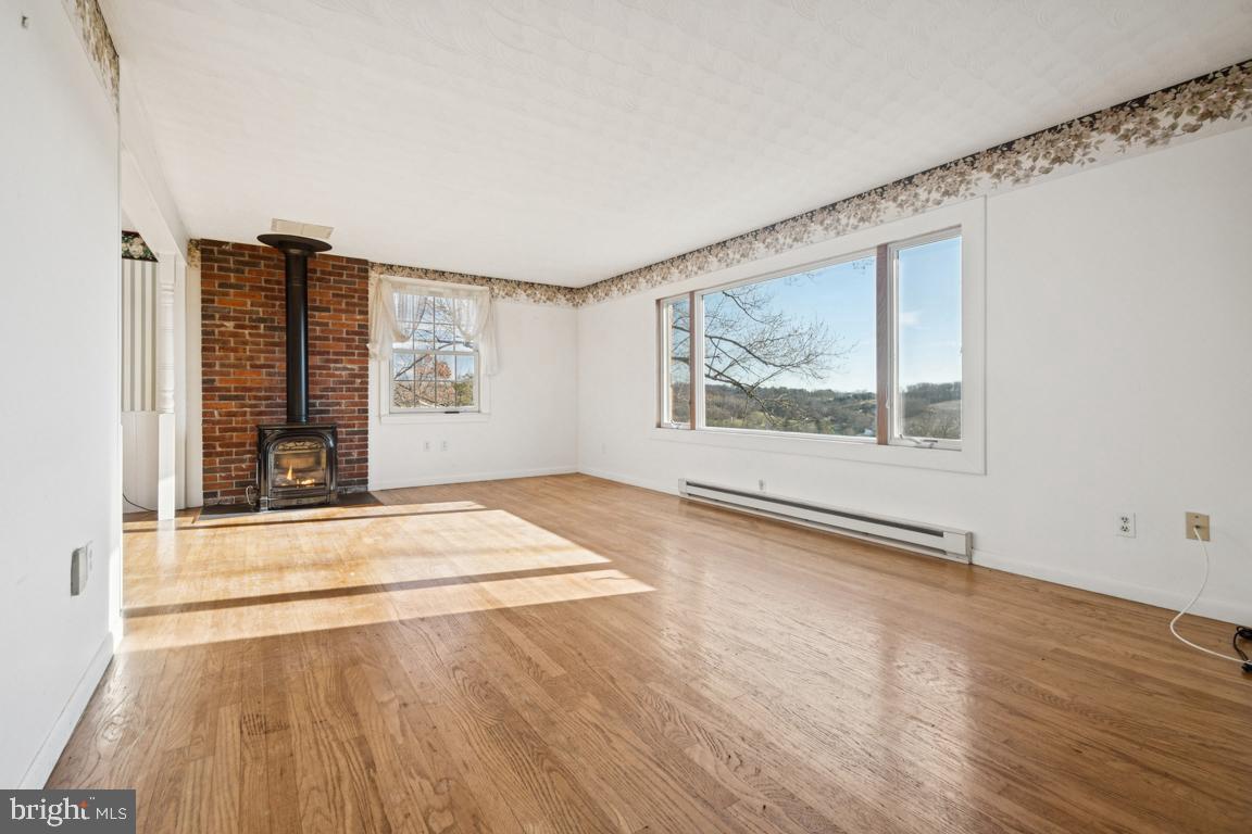 2701 Carrollton Road Finksburg, MD 21048 - Photo 29 of 66 an empty room with wooden floor and windows