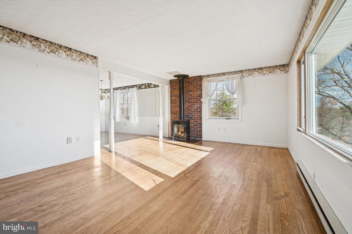 2701 Carrollton Road Finksburg, MD 21048 - Photo 30 of 66 a view of an empty room with wooden floor and a window