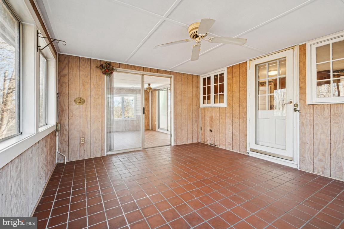 2701 Carrollton Road Finksburg, MD 21048 - Photo 32 of 66 a view of empty room with wooden floor and fan