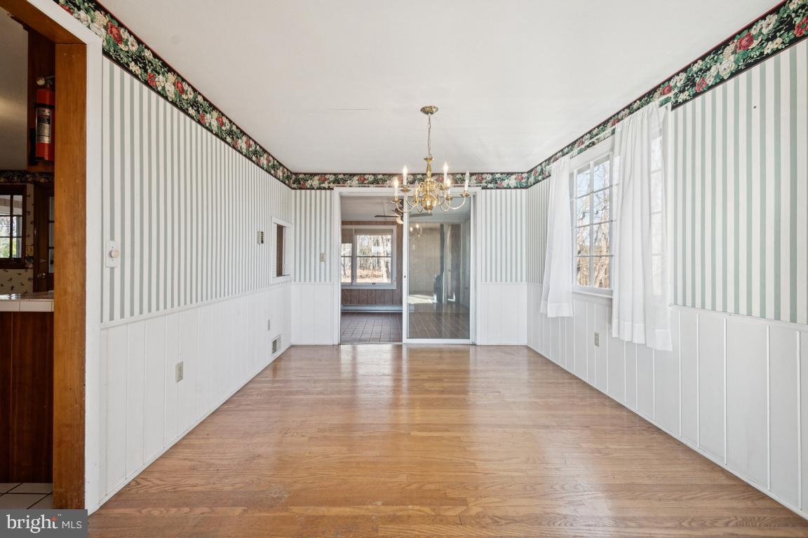 2701 Carrollton Road Finksburg, MD 21048 - Photo 35 of 66 a view of a hallway with wooden floor and staircase