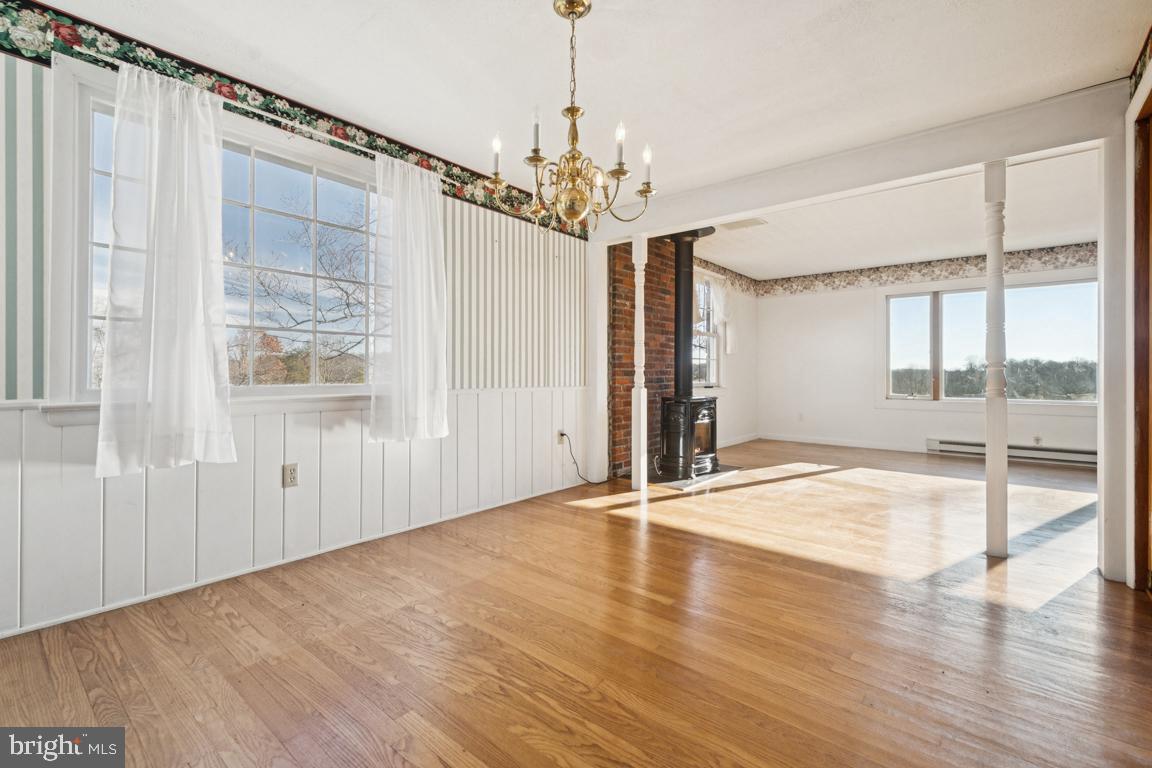 2701 Carrollton Road Finksburg, MD 21048 - Photo 36 of 66 a view of an empty room with wooden floor and a window