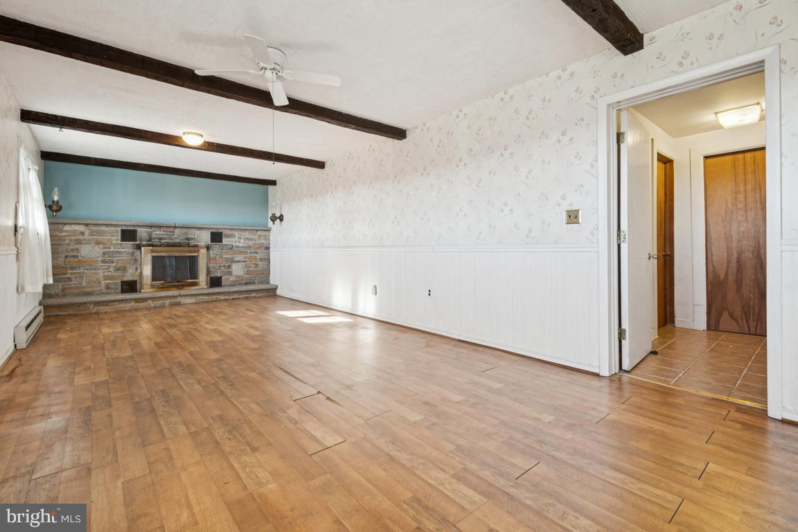 2701 Carrollton Road Finksburg, MD 21048 - Photo 41 of 66 a view of a livingroom with wooden floor and a ceiling fan