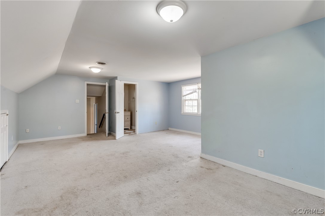 11000 Chalkley Road Chester, VA 23831 - Photo 23 of 30 an empty room with windows and entrance to other room
