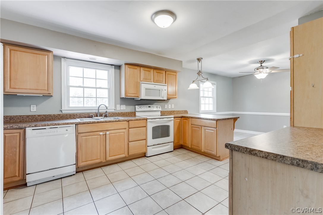 11000 Chalkley Road Chester, VA 23831 - Photo 7 of 30 a kitchen with granite countertop cabinets sink and white appliances