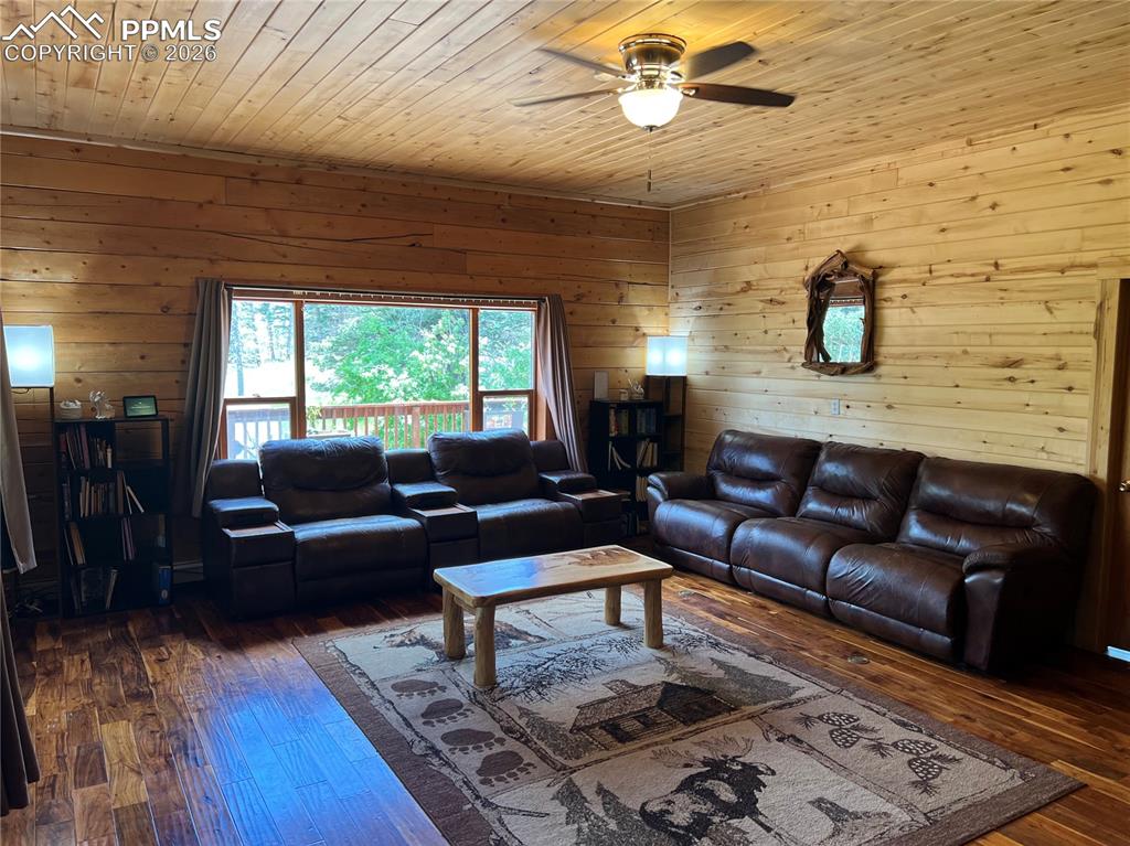 87 Thompson Road Gardner, CO 81040 - Photo 11 of 46 a living room with furniture and wooden floor