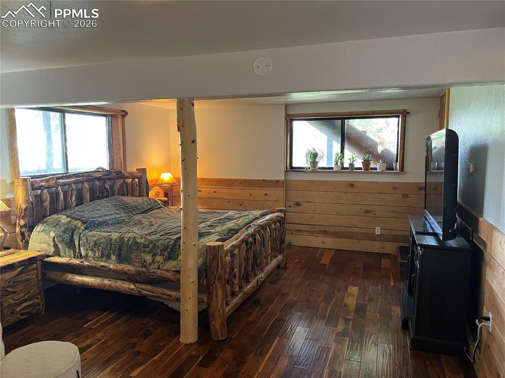 87 Thompson Road Gardner, CO 81040 - Photo 26 of 46 a bedroom with a bed and a flat tv screen on the dresser