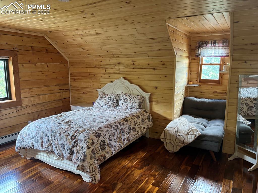 87 Thompson Road Gardner, CO 81040 - Photo 36 of 46 a bedroom with a bed and a mirror