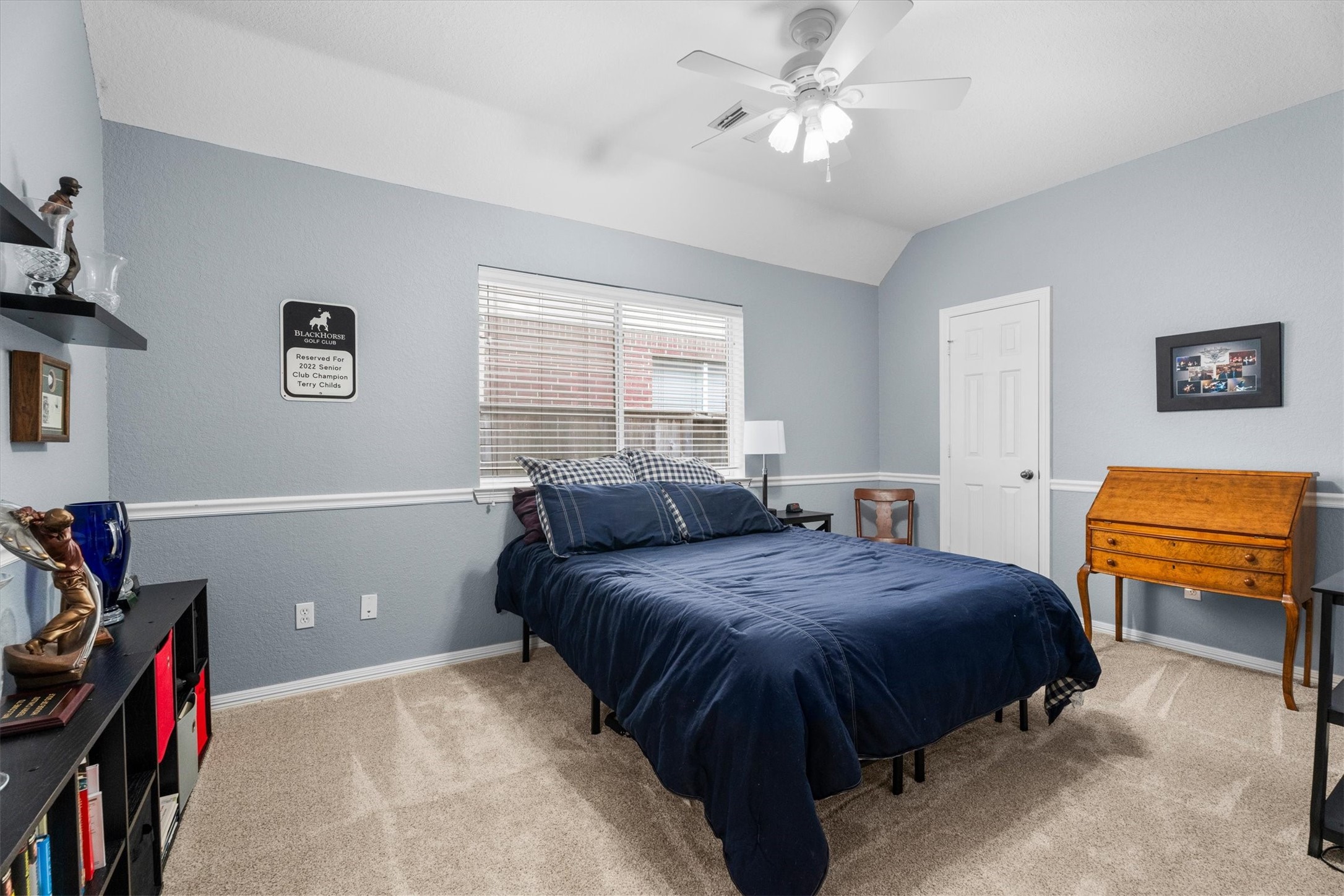 9406 Lochflora Drive Spring, TX 77379 - Photo 22 of 49 a bedroom with a bed and a chandelier