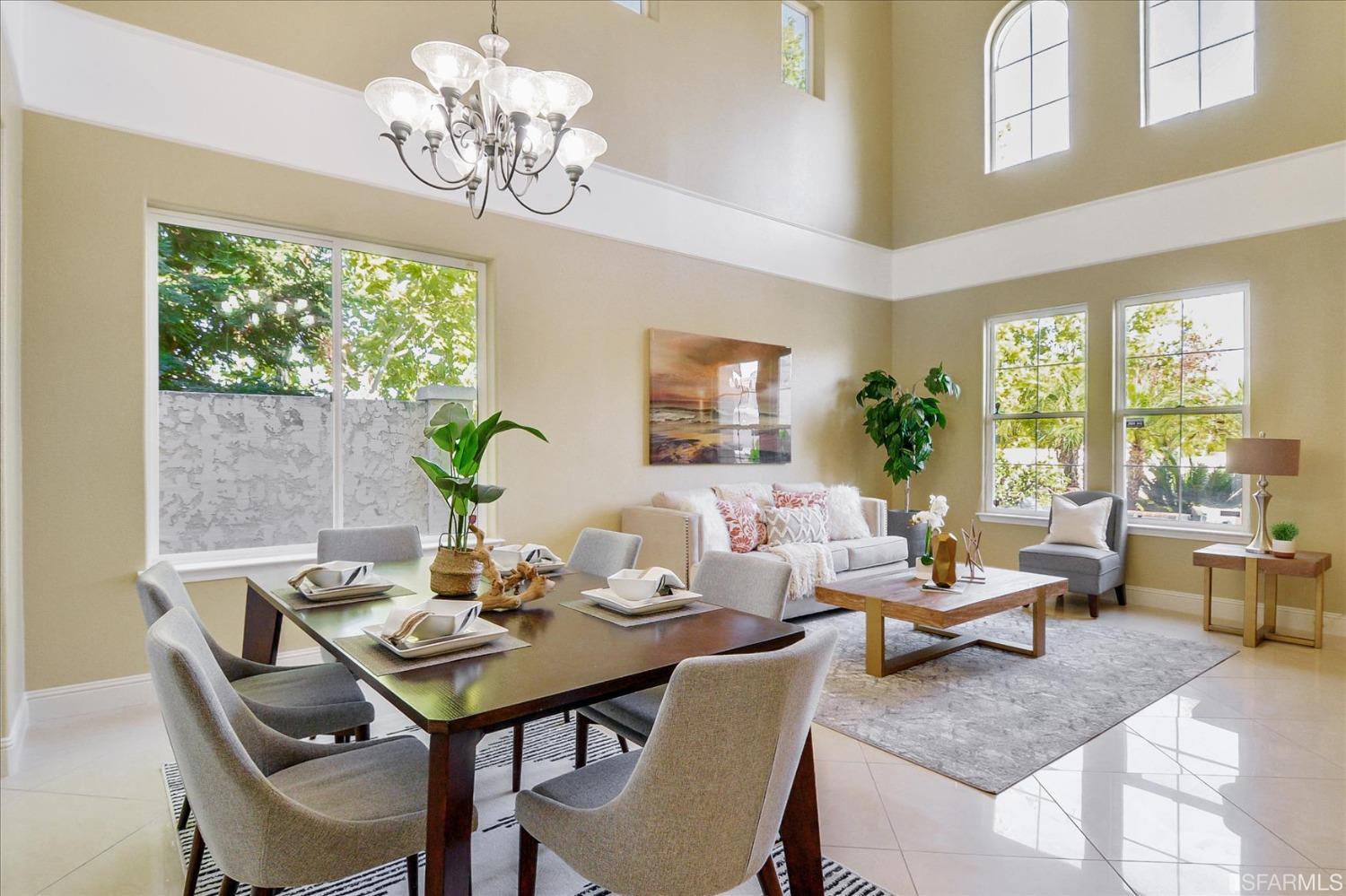 4100 Diorite Court Antioch, CA 94531 - Photo 18 of 58 a view of a dining room with furniture a chandelier and large windows