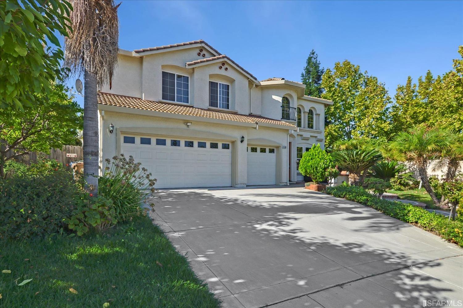4100 Diorite Court Antioch, CA 94531 - Photo 2 of 58 a front view of a house with a yard and garage