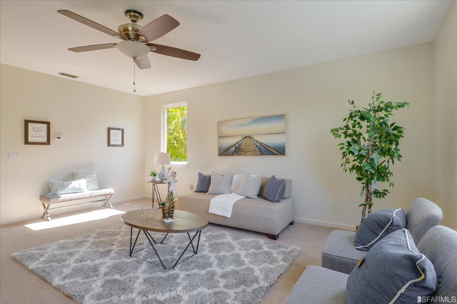 4100 Diorite Court Antioch, CA 94531 - Photo 22 of 58 a living room with furniture a chandelier and a potted plant