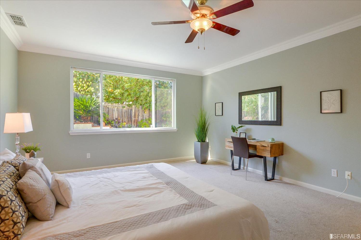 4100 Diorite Court Antioch, CA 94531 - Photo 25 of 58 a bedroom with a bed and a chandelier