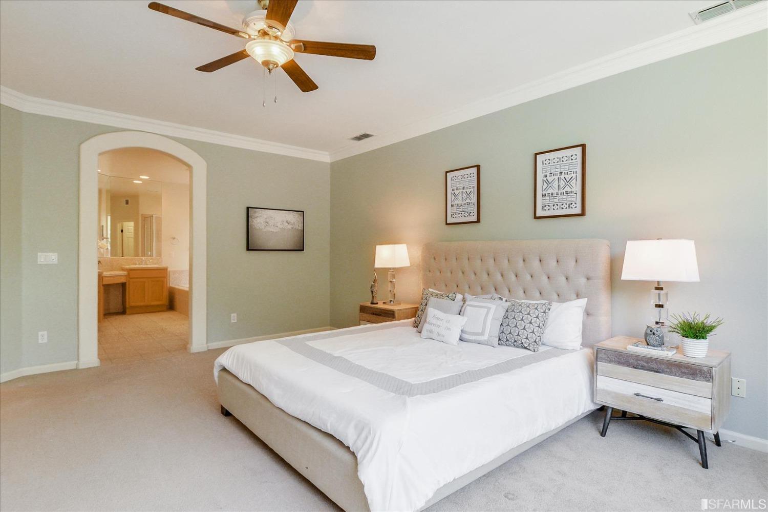 4100 Diorite Court Antioch, CA 94531 - Photo 26 of 58 a spacious bedroom with a bed and a chandelier