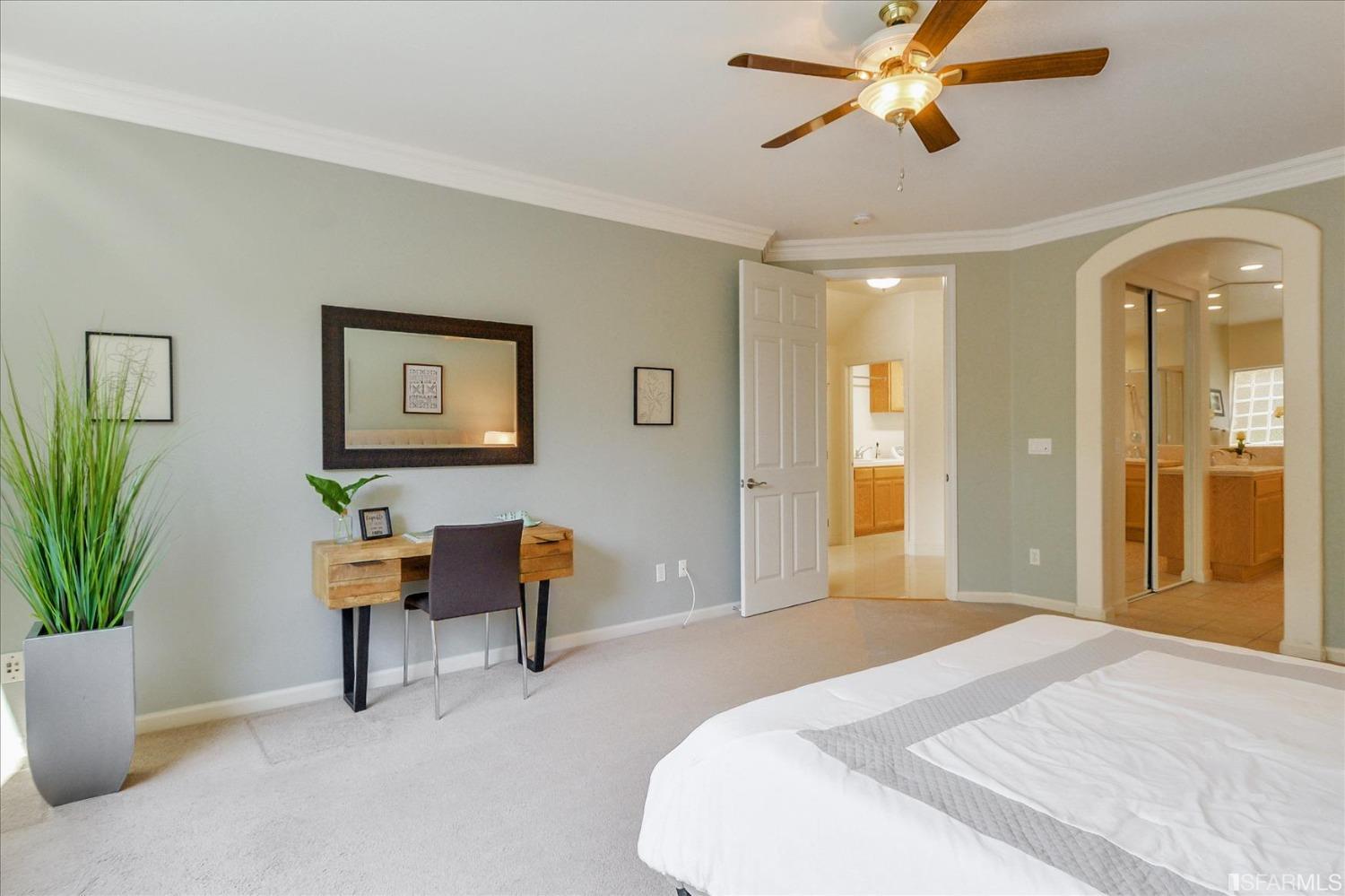 4100 Diorite Court Antioch, CA 94531 - Photo 27 of 58 a bedroom with a bed and a chandelier