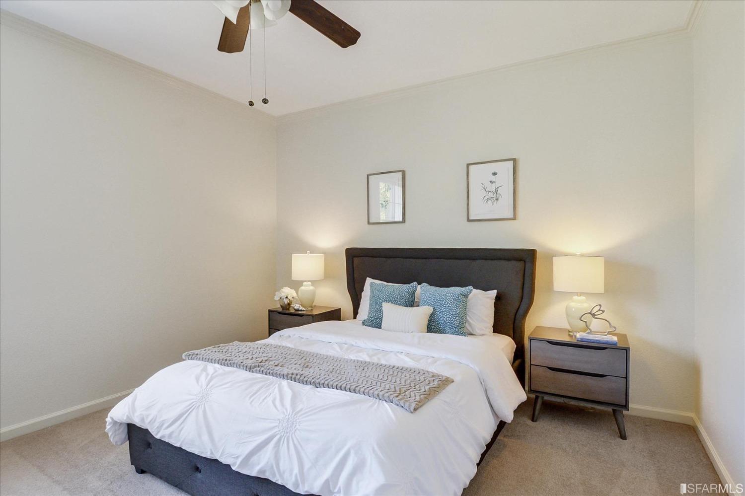 4100 Diorite Court Antioch, CA 94531 - Photo 31 of 58 a bedroom with a bed and a chandelier