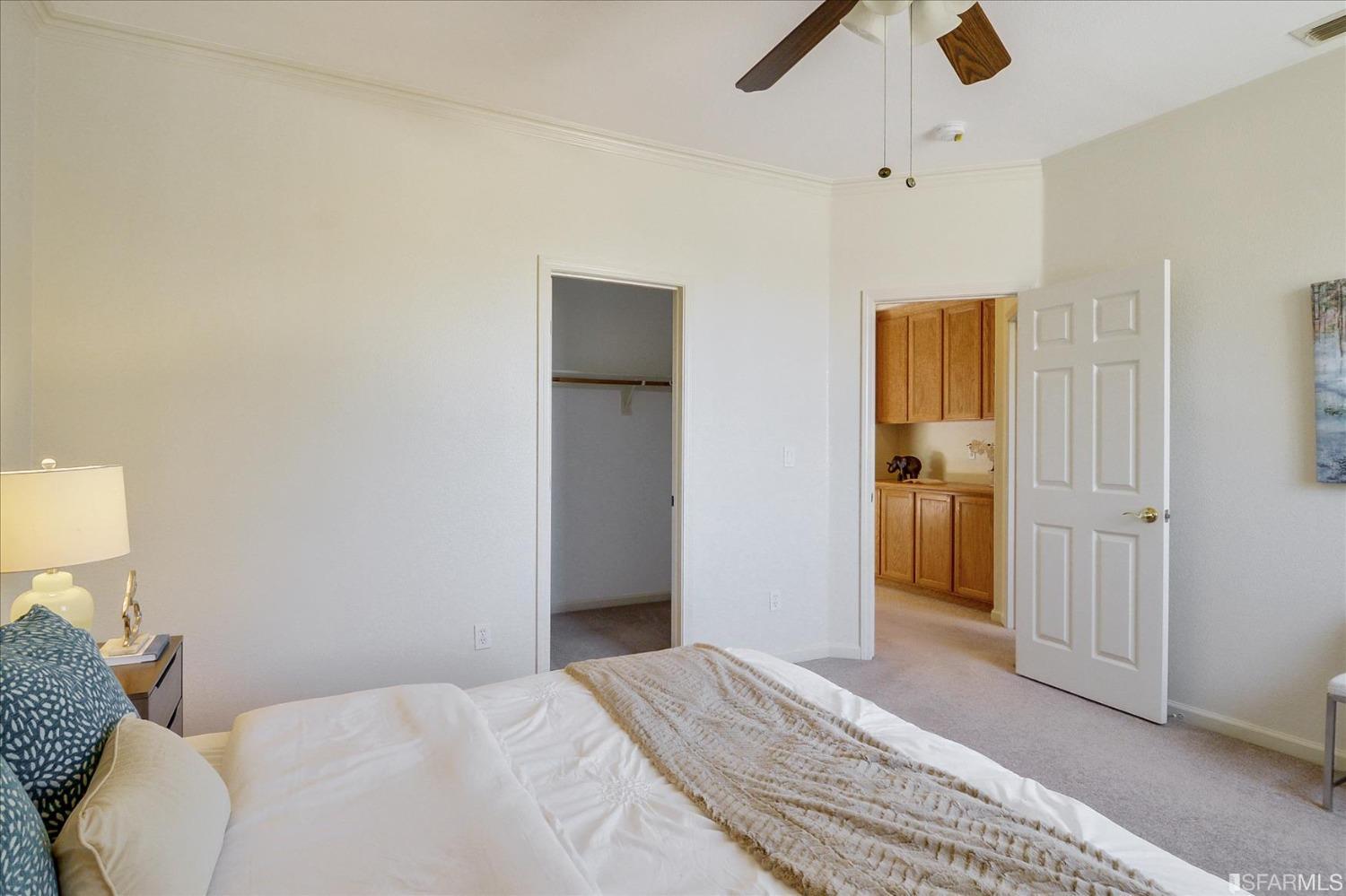 4100 Diorite Court Antioch, CA 94531 - Photo 33 of 58 a bedroom with a bed and a chandelier
