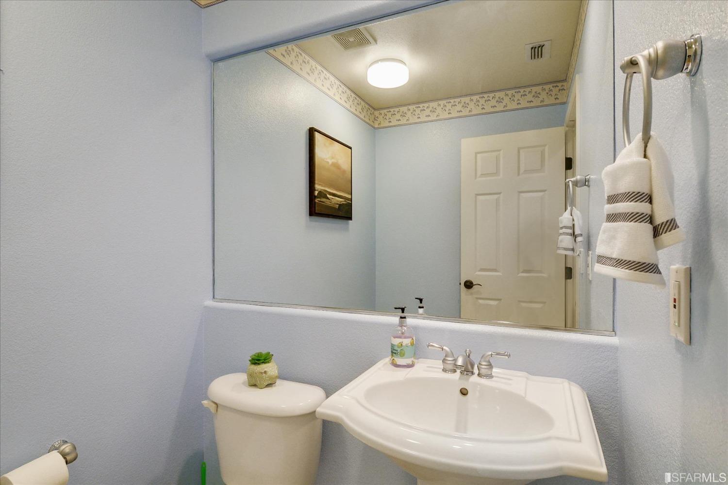4100 Diorite Court Antioch, CA 94531 - Photo 38 of 58 a bathroom with a sink a toilet and a mirror