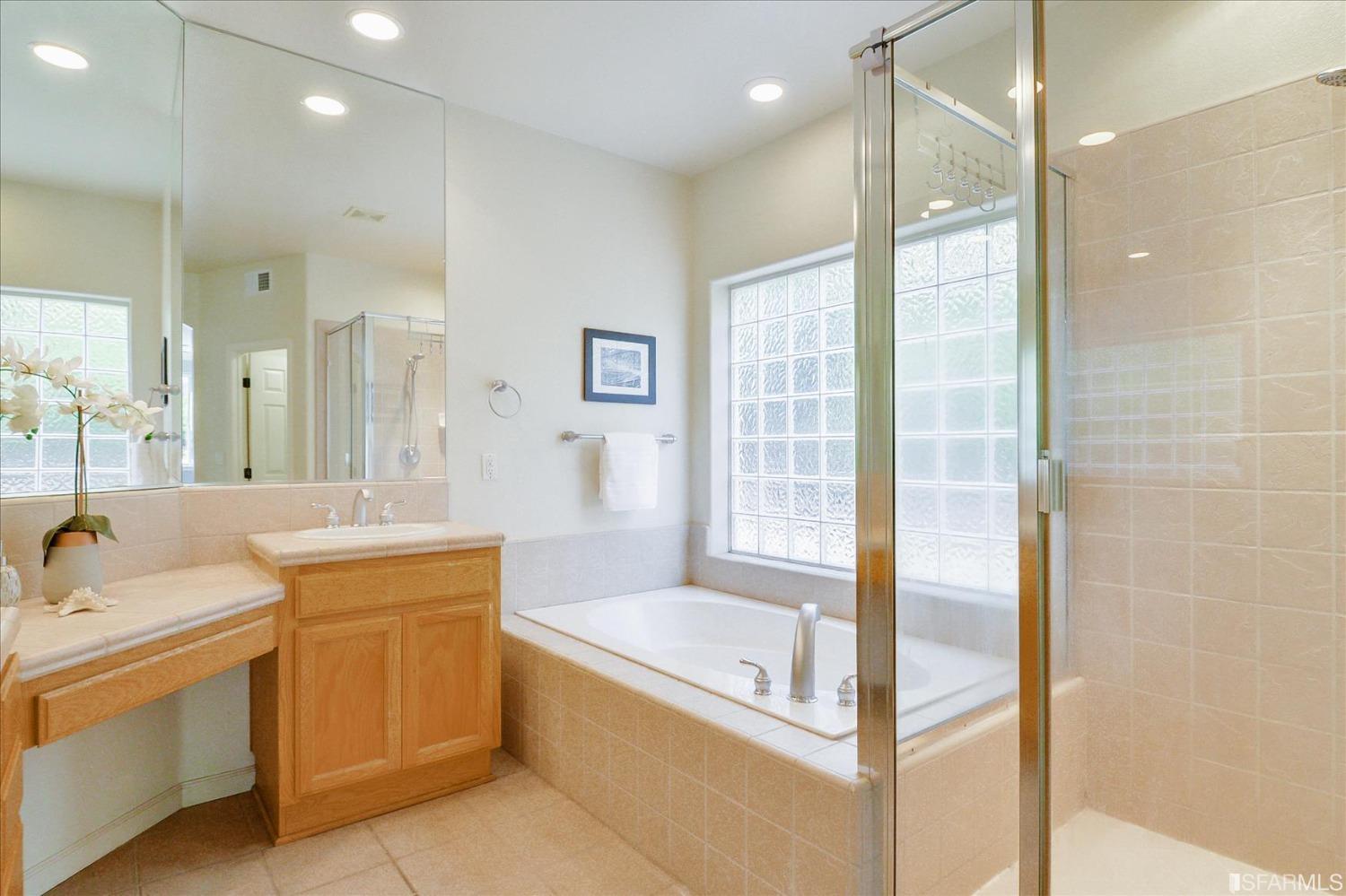 4100 Diorite Court Antioch, CA 94531 - Photo 40 of 58 a bathroom with a tub sink shower and mirror