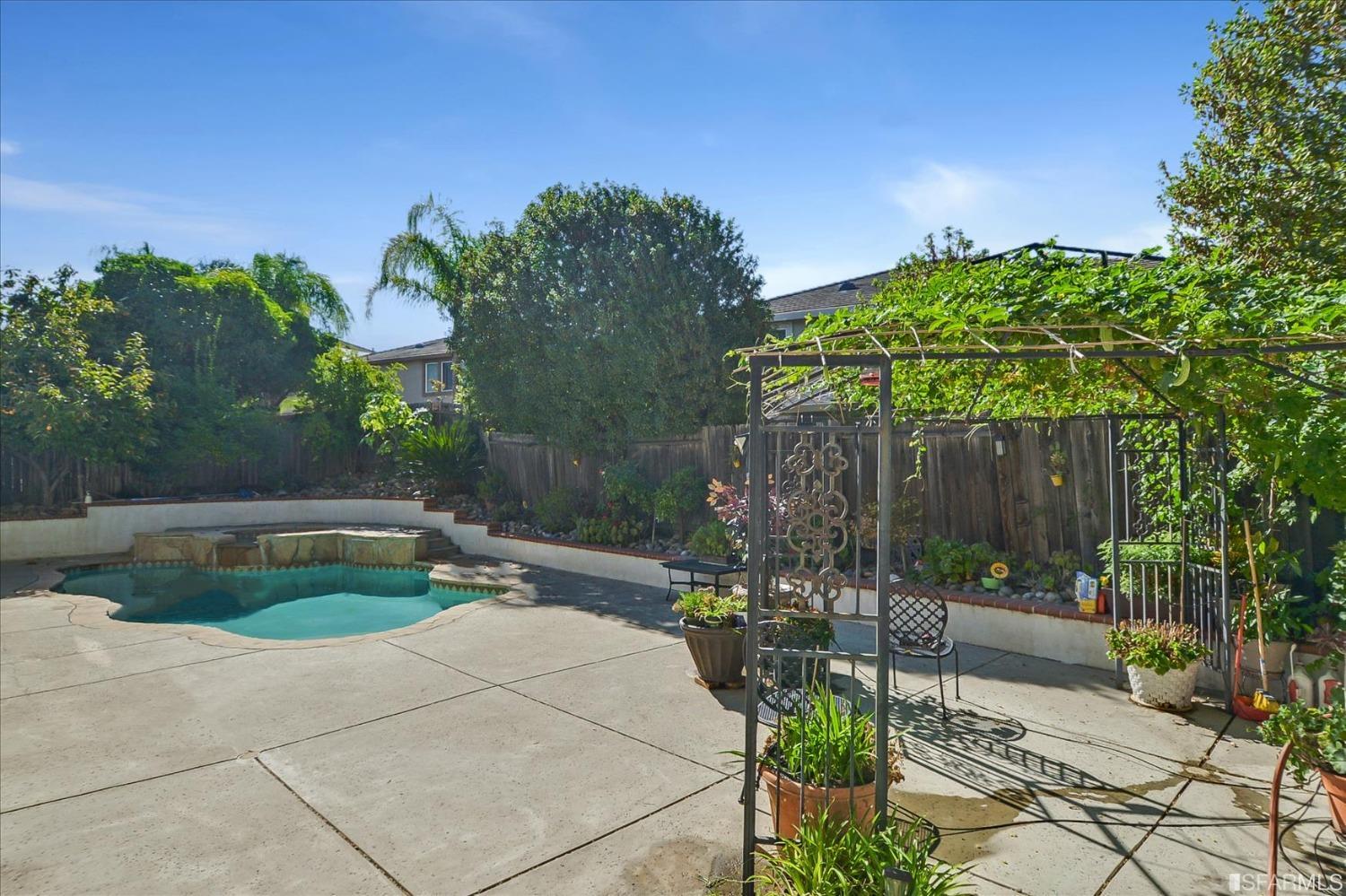 4100 Diorite Court Antioch, CA 94531 - Photo 48 of 58 a backyard of a house with lots of green space and fountain