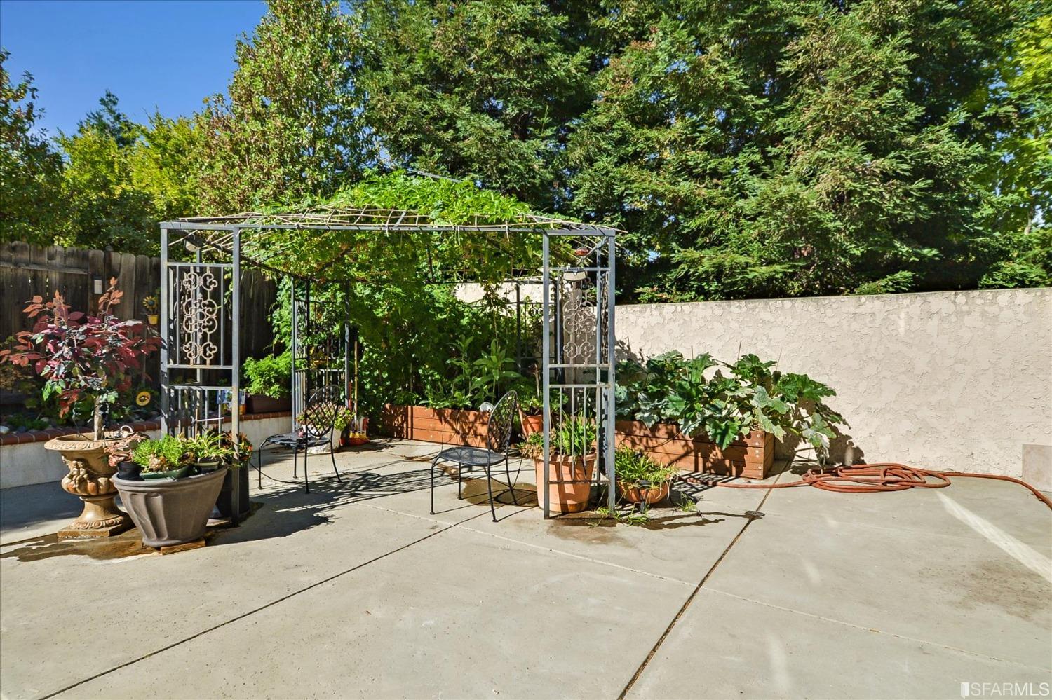 4100 Diorite Court Antioch, CA 94531 - Photo 49 of 58 a view of a patio with a table and chairs and potted plants