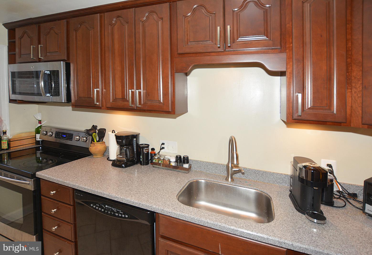2902 13th Road South, Unit 102 Arlington, VA 22204 - Photo 11 of 20 Cherry wood cabinetry