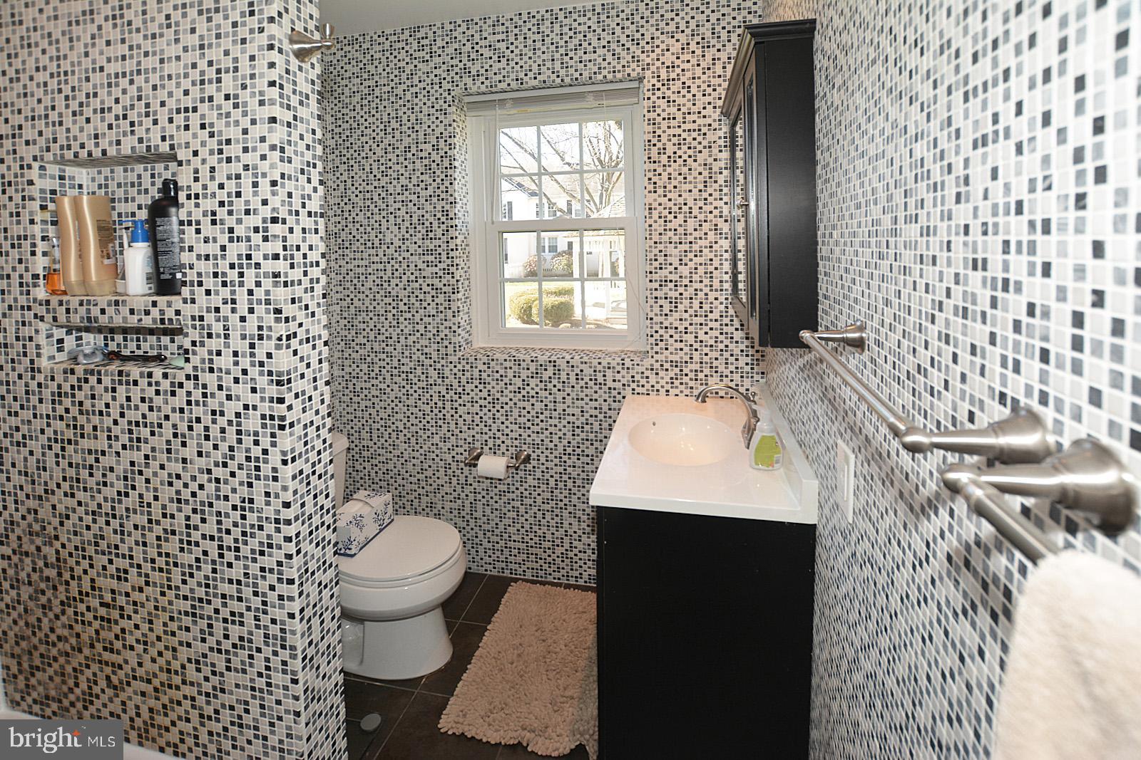 2902 13th Road South, Unit 102 Arlington, VA 22204 - Photo 16 of 20 Full bathroom with custom tile work