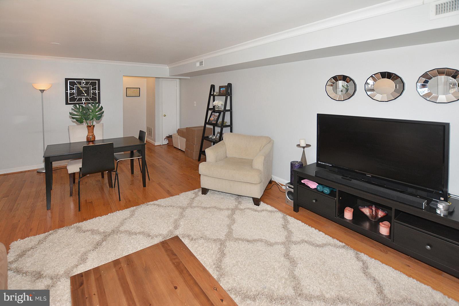 2902 13th Road South, Unit 102 Arlington, VA 22204 - Photo 5 of 20 Dining/living areas with hardwood floors