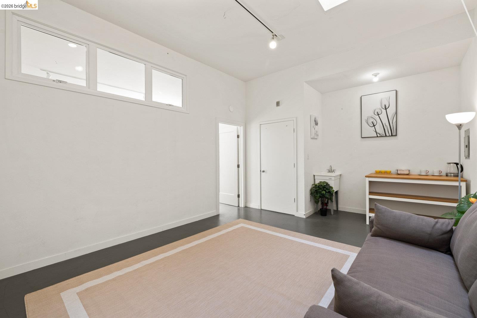1450 Fourth Street, Unit 5 Berkeley, CA 94710 - Photo 15 of 26 a livingroom with furniture and a gate