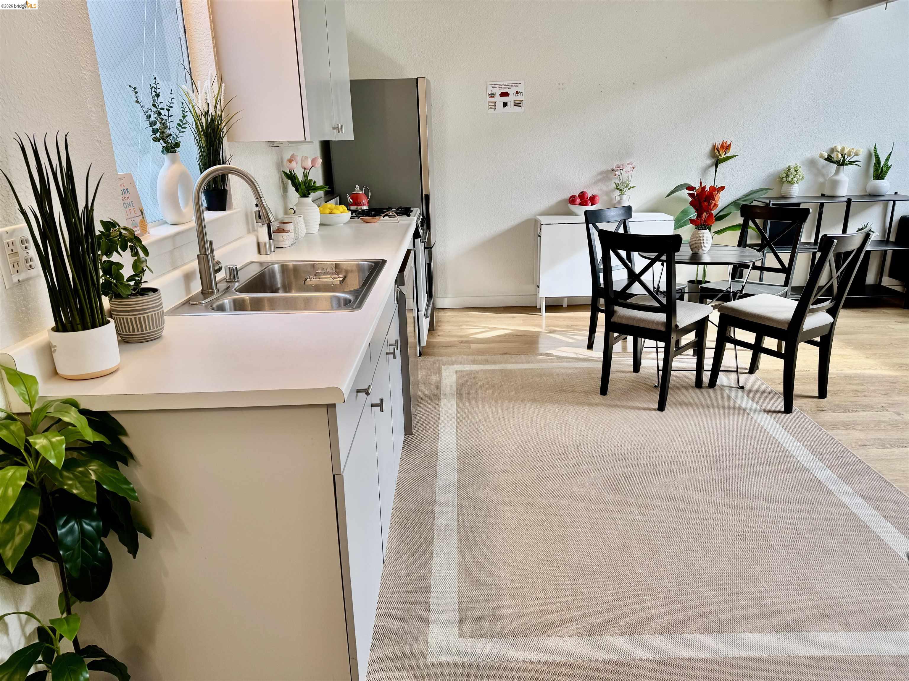 1450 Fourth Street, Unit 5 Berkeley, CA 94710 - Photo 2 of 26 a dining room with furniture and potted plants